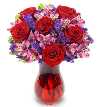  Red Roses
* Purple Alstroemeria
* Purple Statice
* Red Swirl Vase