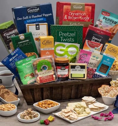 This wholesome gift basket is jam packed with delicious nutritious treats for all to enjoy. Whether your lucky recipient is on a diet, or just health conscious, this thoughtful gift is made up of the perfect selection of good for you treats such as tea, nut clusters, fruit candies, cheese, crackers, and more!

Includes:
* Cinnamon & Brown Sugar Kettle Corn - 4.2 oz.
* Sea Salt & Cracked Pepper Kettle Corn - 4 oz.
* Chichester Snack Mix - 2 oz.
* Sea Salt & Cracked Peppercorn Water Crackers - 4 oz.
* Pretzel Twists - 3 oz.
* Oatcake Biscuits - 7.2 oz.
* Nutcakes - 7.2 oz.
* Earl Grey Tea - 8 sachets
* Stoned Wheat Crackers - 4 oz.
* Sour Cherry Preserves - 12.3 oz.
* Garlic Cheese - 6 oz.
* Blueberry Pomegranate Trail Mix Crunch - 1 oz.
* Cracked Pepper Turkey Jerky - 1 oz.
* Roasted & Salted Peanuts - 2 oz.
* Almondina Biscuits - 4 oz.
* Almond Cashew Clusters with Pumpkin Seeds - 1 oz.
* Assorted Fruits Chewy Candies - 3.5 oz.
* Pomegranate Hard Candies - 3.5 oz.